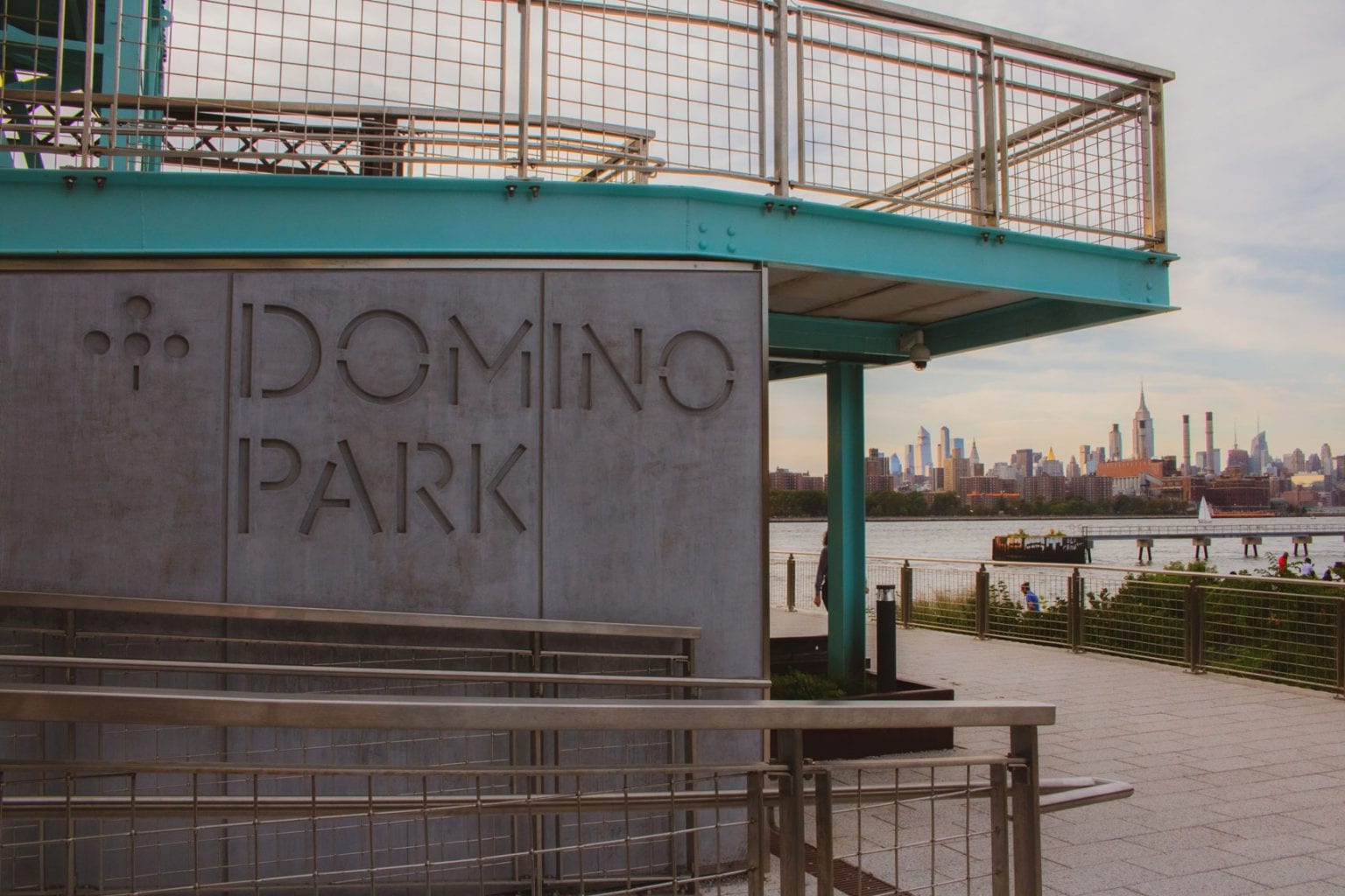The large, concrete sign of Domino Park.