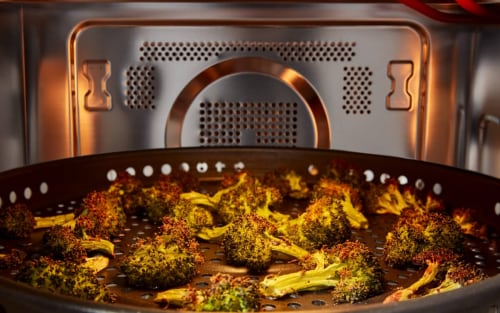 Broccoli air frying in a microwave cavity