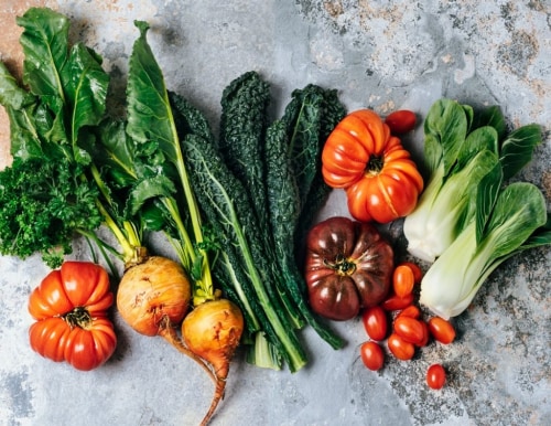 A table featuring a variety of heirloom vegetables.