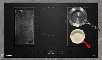 Various pans on an induction cooktop.